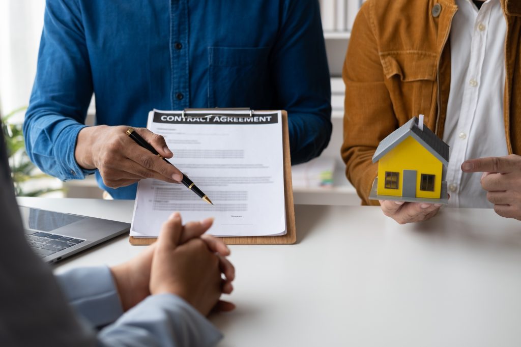 Close up view of professional real estate agent giving legal advice, selling insurance and real esta